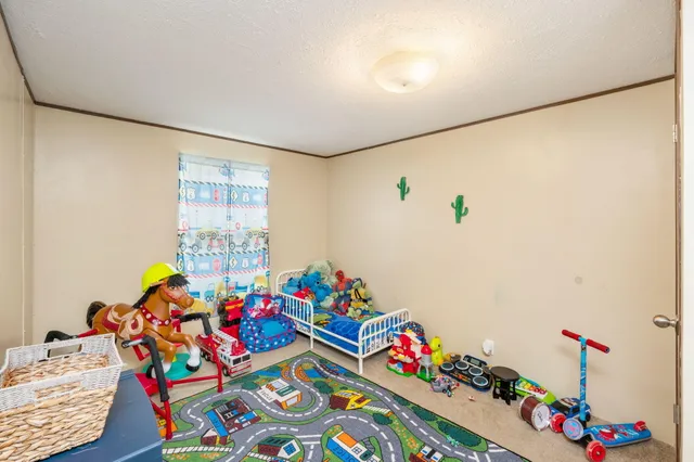 a room with toys and a wooden floor