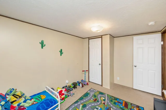 a room with toys and wooden floor