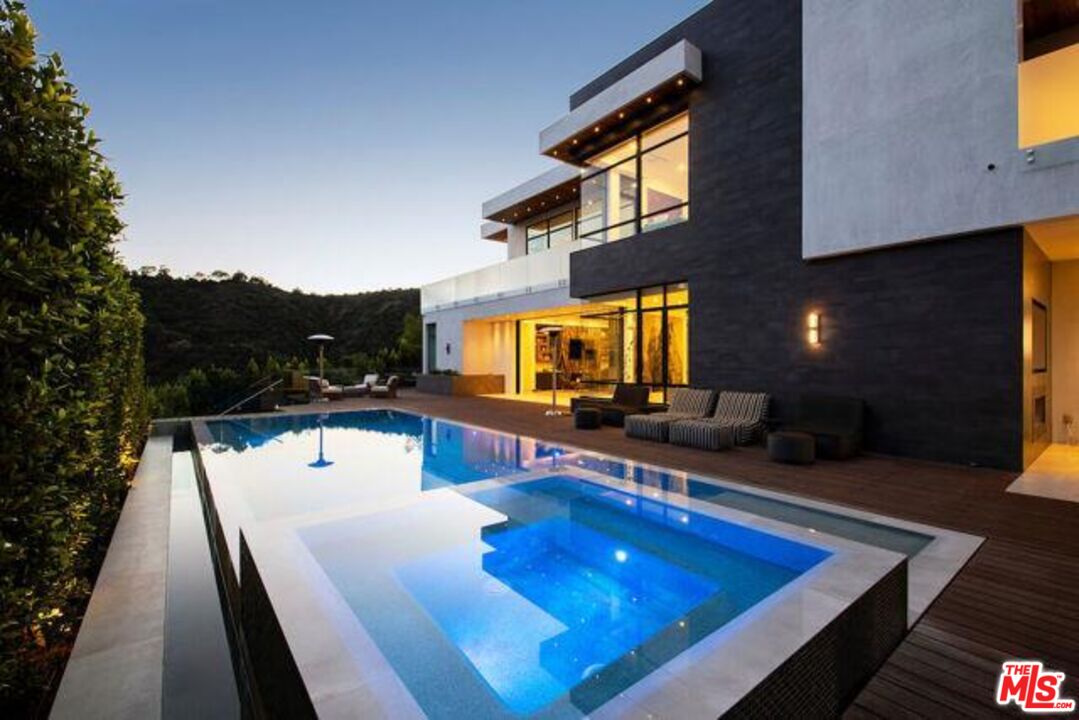 Undisclosed Address Beverly Hills, CA 90210 - Photo 11 of 47 a view of swimming pool with seating area and furniture