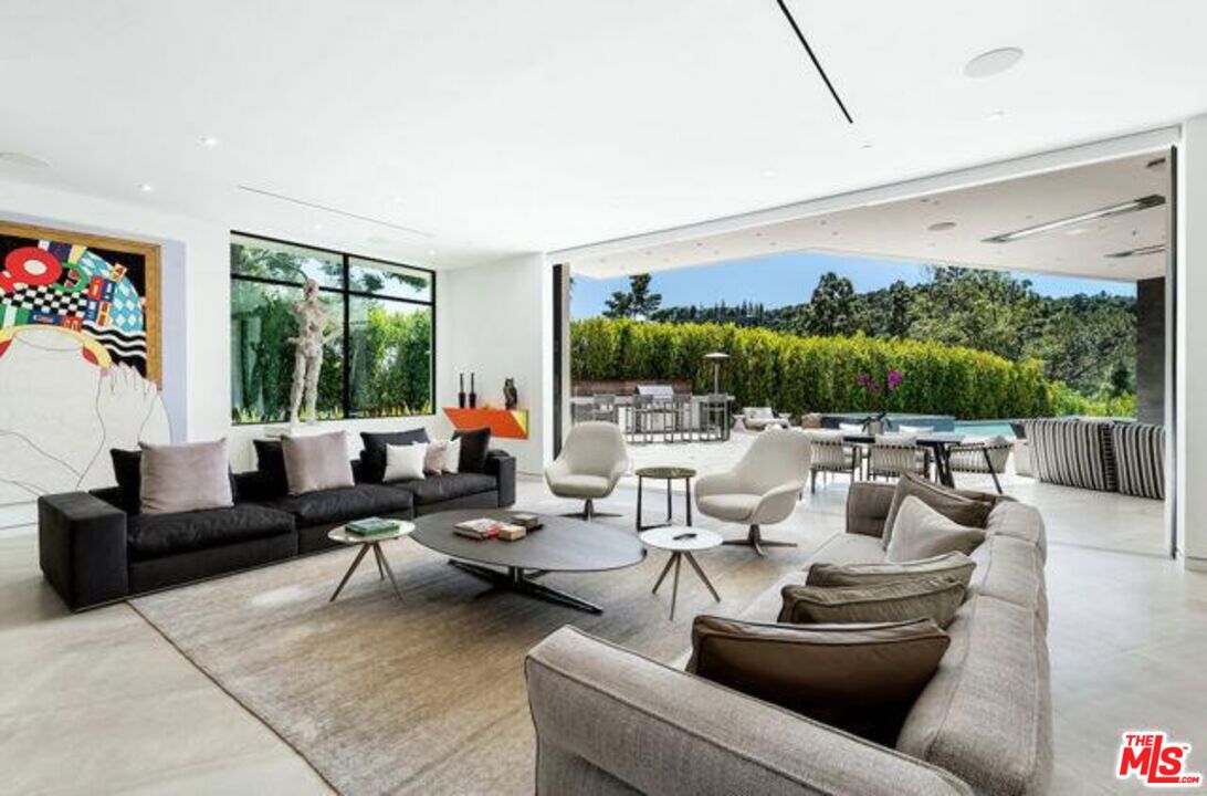 Undisclosed Address Beverly Hills, CA 90210 - Photo 19 of 47 a living room with furniture and a large window