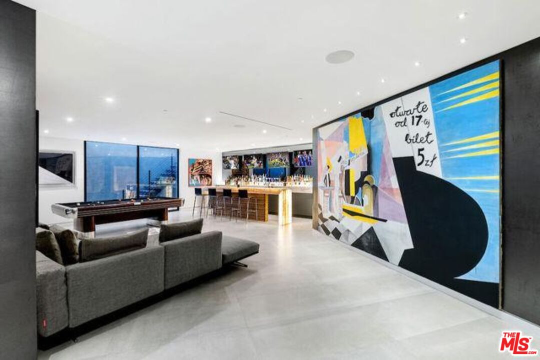 Undisclosed Address Beverly Hills, CA 90210 - Photo 27 of 47 a living room with furniture and a flat screen tv