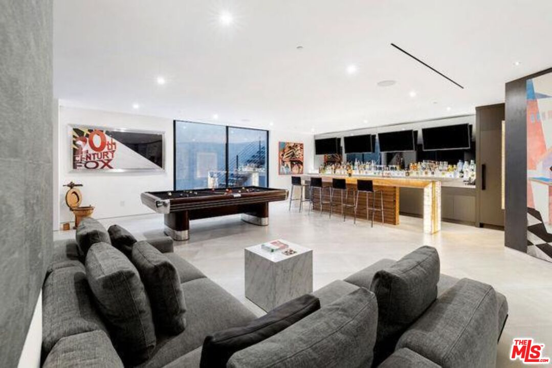 Undisclosed Address Beverly Hills, CA 90210 - Photo 28 of 47 a living room with furniture and a flat screen tv