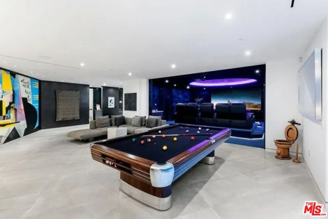 a building with pool table and furniture