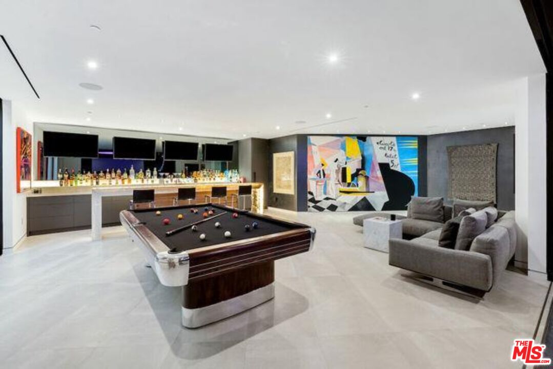 Undisclosed Address Beverly Hills, CA 90210 - Photo 32 of 47 a kitchen with stainless steel appliances granite countertop a stove and a sink