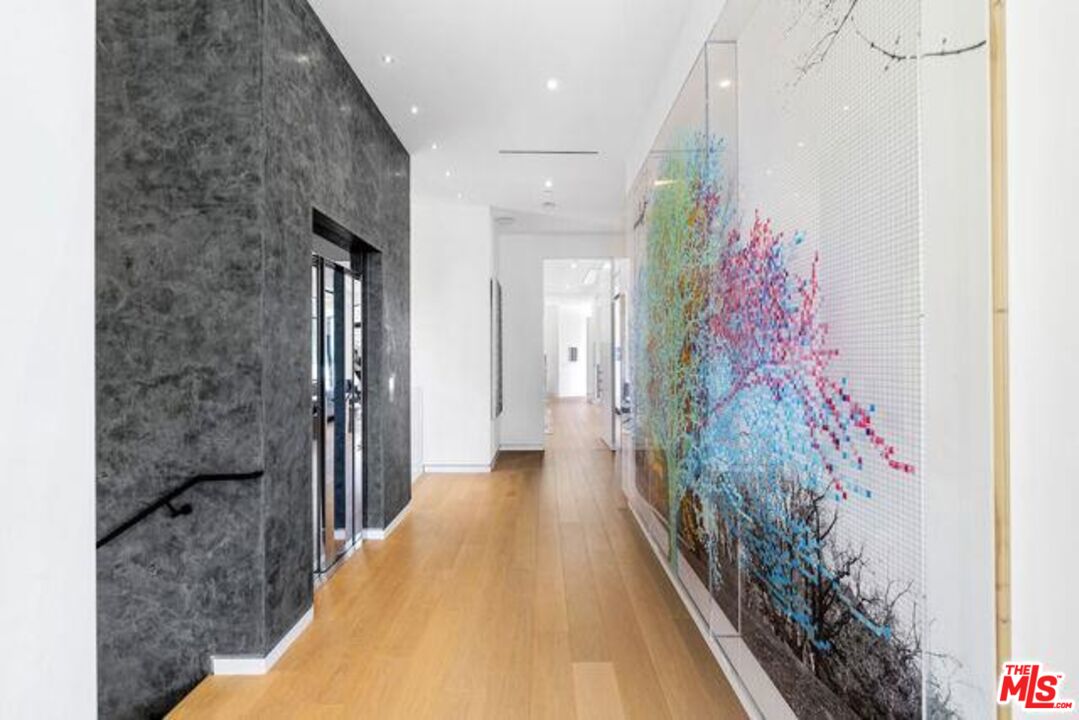 Undisclosed Address Beverly Hills, CA 90210 - Photo 33 of 47 a hallway with a dining table and entryway