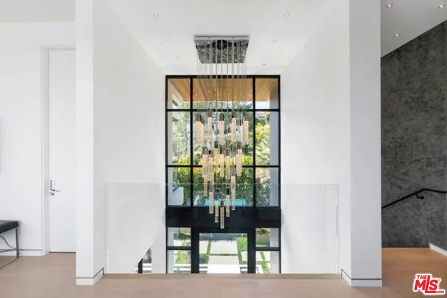 a balcony with table and chairs