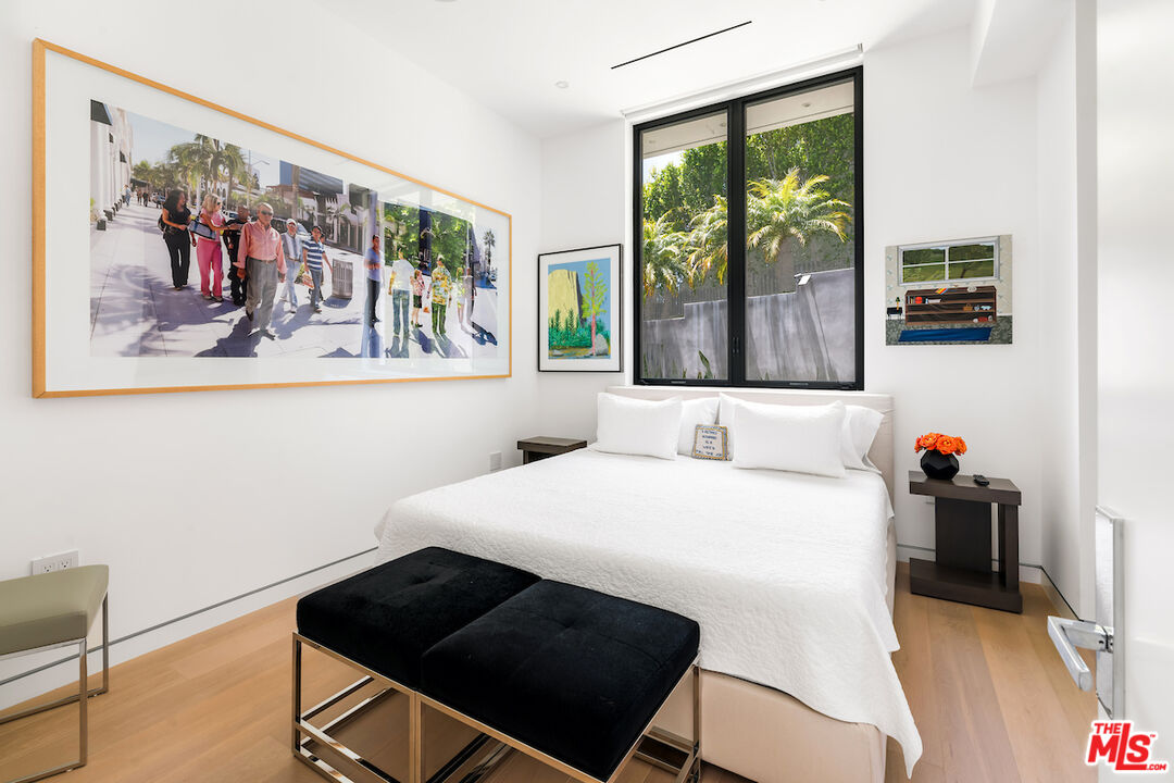 Undisclosed Address Beverly Hills, CA 90210 - Photo 43 of 47 a bedroom with a bed and a large window with outer view