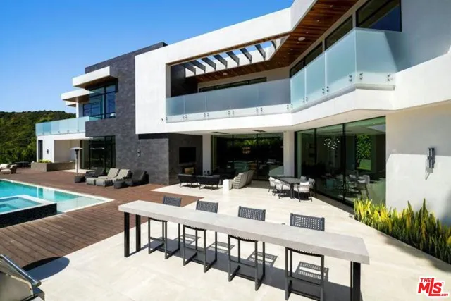 a view of a patio with a table and chairs