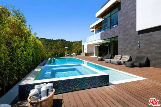 a view of a patio with chairs and a fire pit