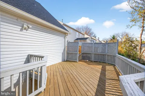a view of balcony with wooden floor