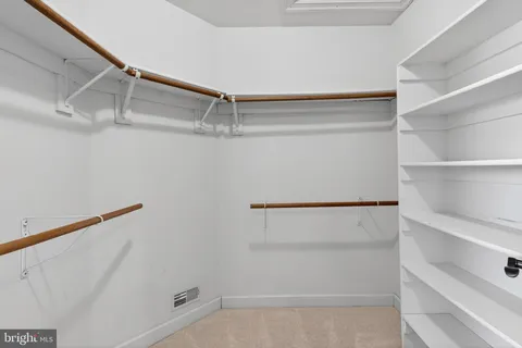 a view of an empty walk in closet