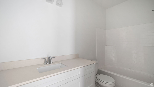 717 South Harrison Drive West Springville, UT 84663 - Photo 20 of 31 Bathroom featuring a white vanity with an integrated sink, polished chrome faucet, light-toned countertop, and a white subway tile tub surround
