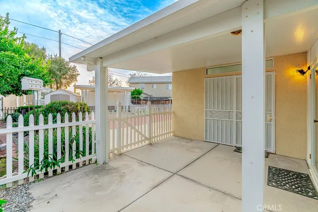 a view of a porch with wooden fence
