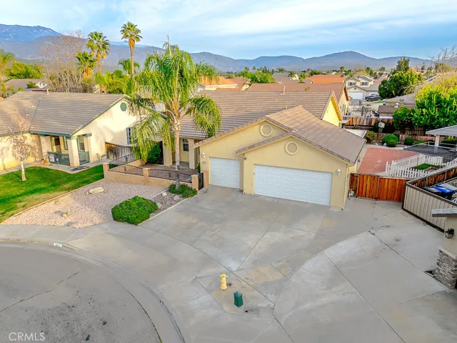 a view of multiple houses with a street
