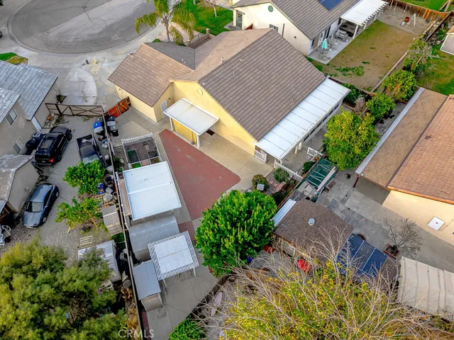 an aerial view of a house with a yard