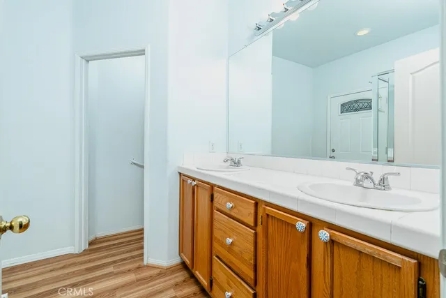 a bathroom with a sink double vanity and a mirror