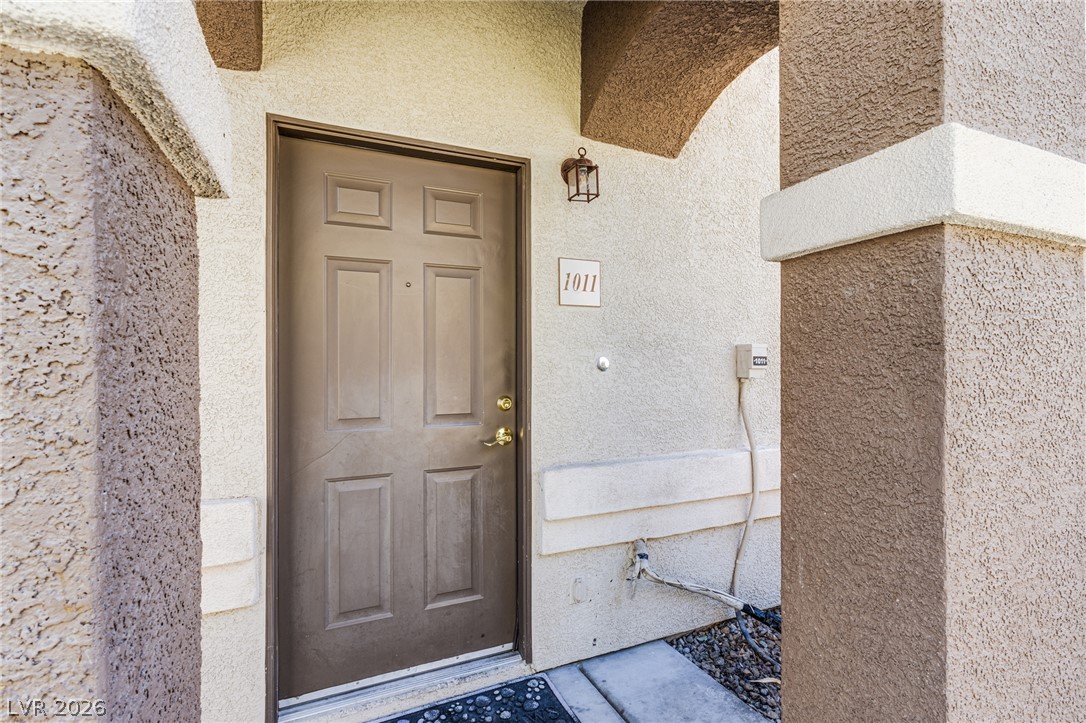 A welcoming entry invites you home with a textured stucco facade.