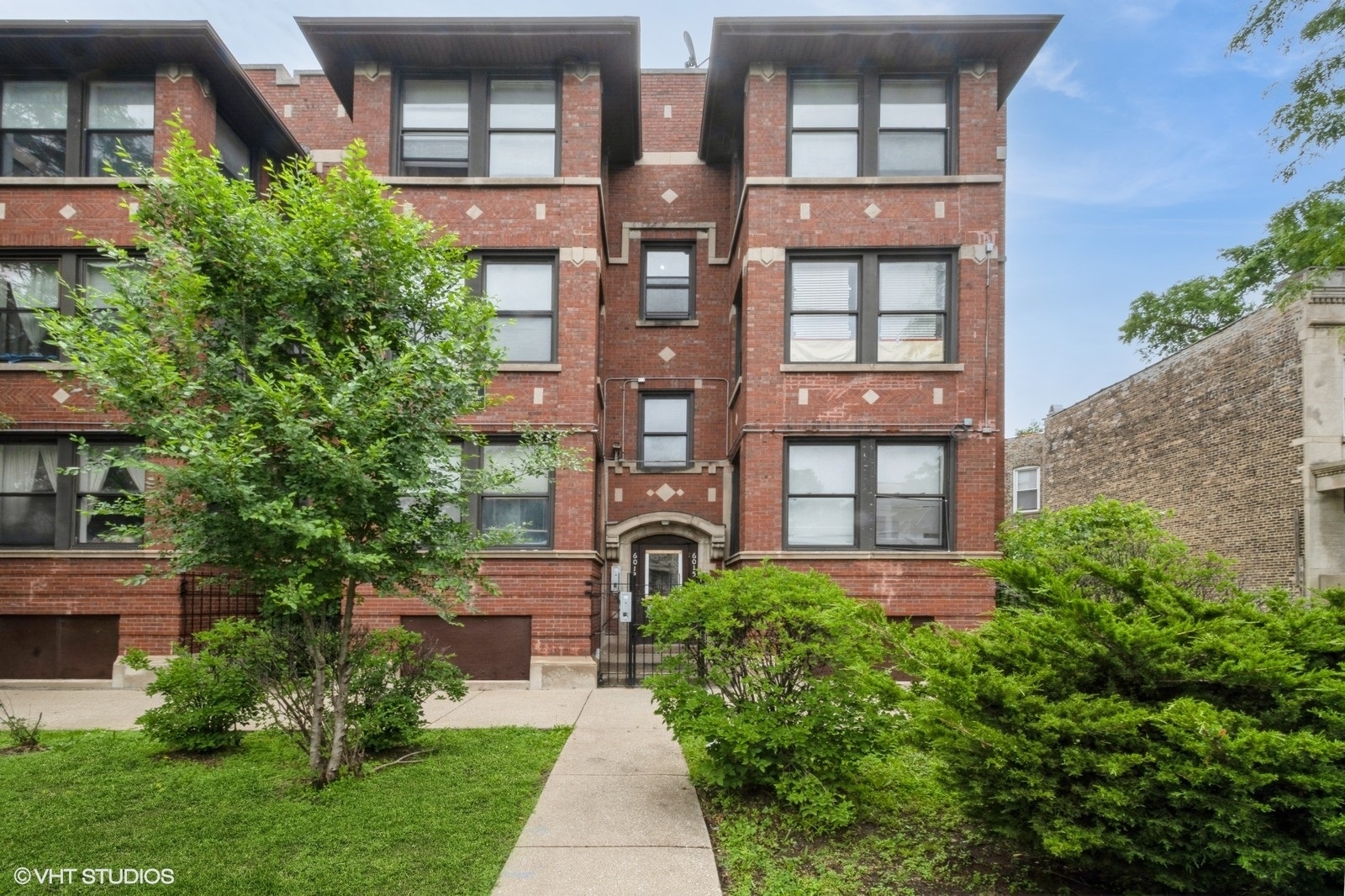6007 South Michigan Avenue, Unit 3 Chicago, IL 60637 - Photo 1 of 9 front view of a brick house