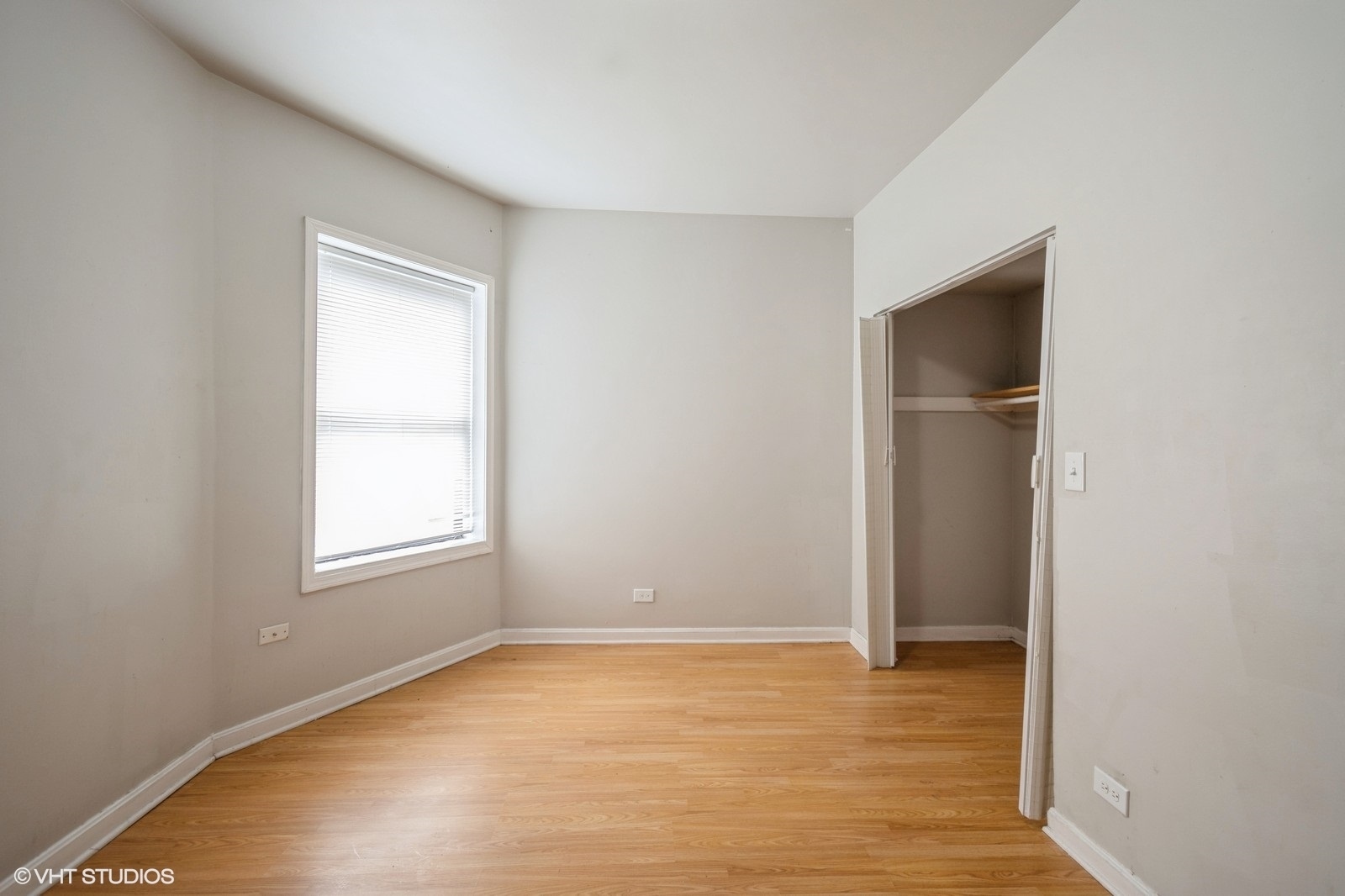 6007 South Michigan Avenue, Unit 3 Chicago, IL 60637 - Photo 5 of 9 an empty room with window and closet