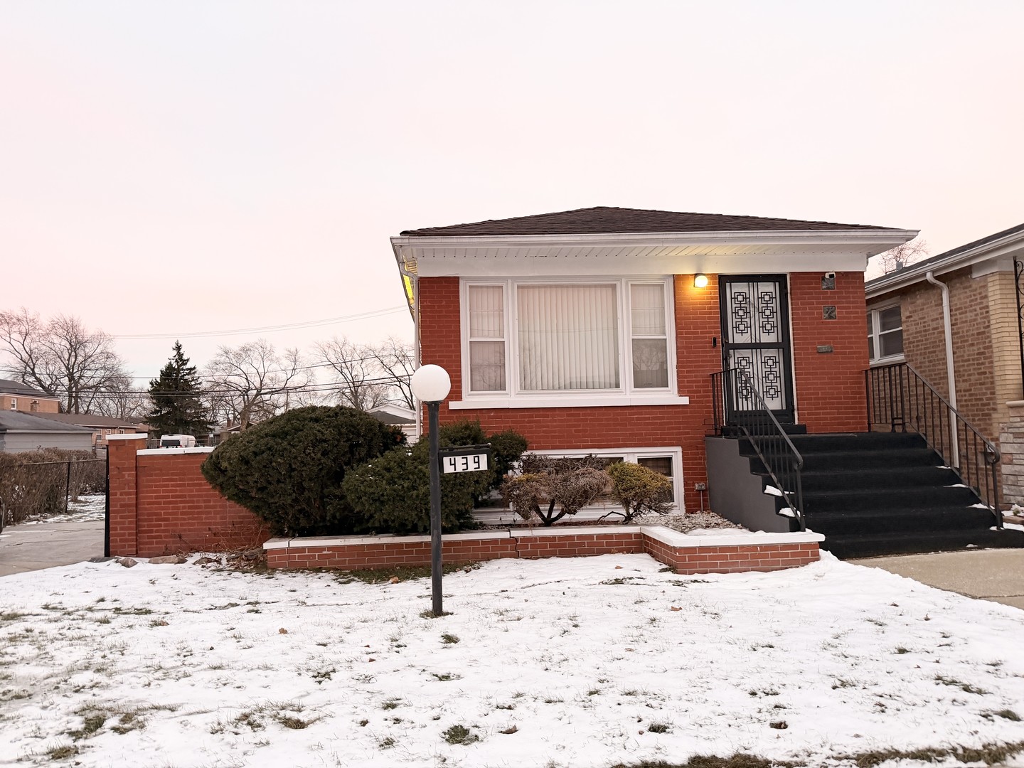 439 West 96th Place Chicago, IL 60628 - Photo 1 of 2 a front view of a house