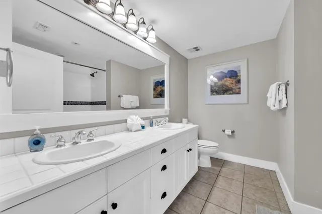 a bathroom with a shower and a bath tub