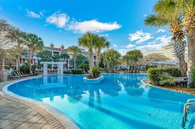 a view of a swimming pool with an outdoor seating