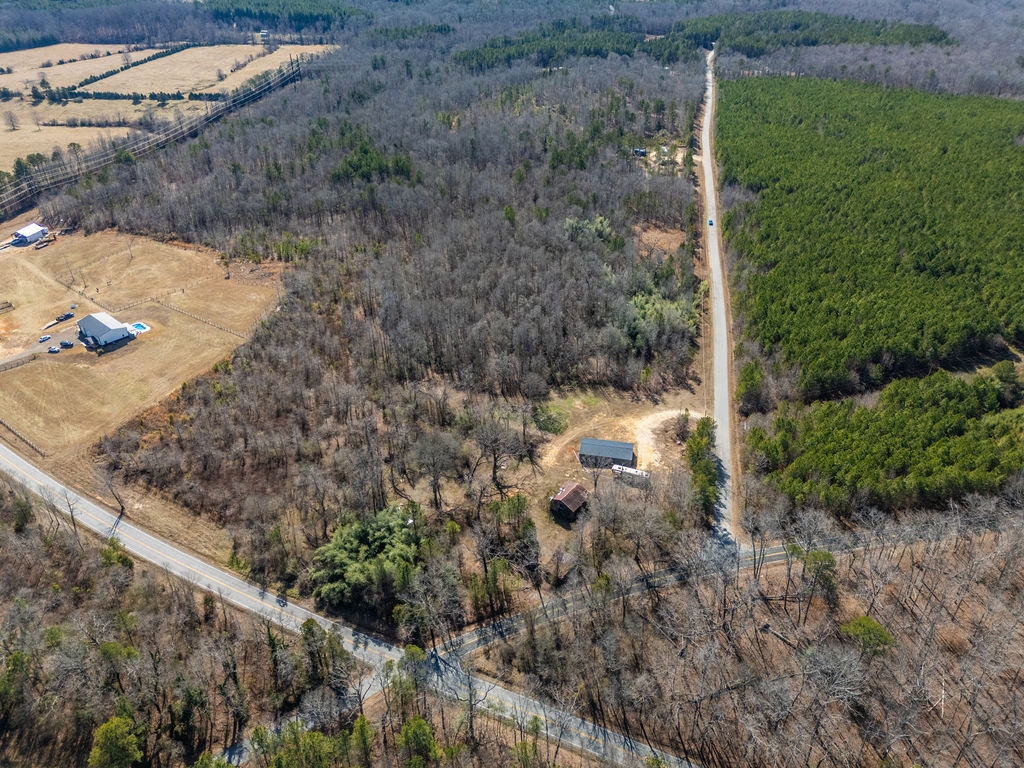 900 Asaville School Road Anderson, SC 29621 - Photo 20 of 29 An expansive rural landscape awaits, featuring open fields and lush woodlands.