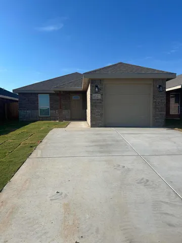 a front view of a house with yard