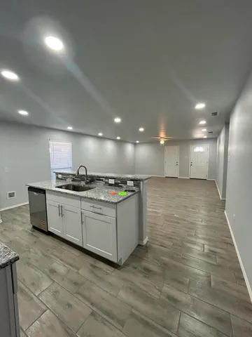 a kitchen with a sink and cabinets
