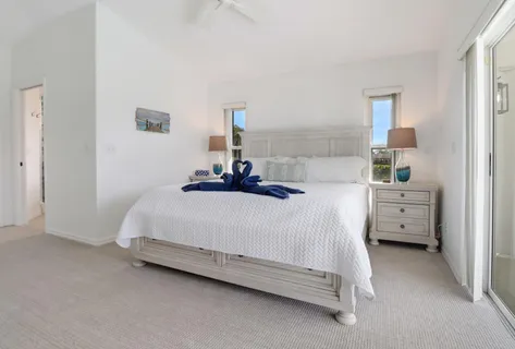 a bedroom with a bed and a cabinets