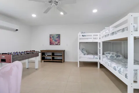 a bedroom with furniture and a chandelier