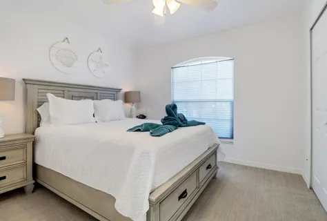 a room with a bed and a chandelier