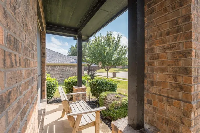 a view of a chair and table in balcony