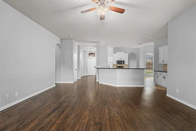 a view of kitchen with closet and wooden floor