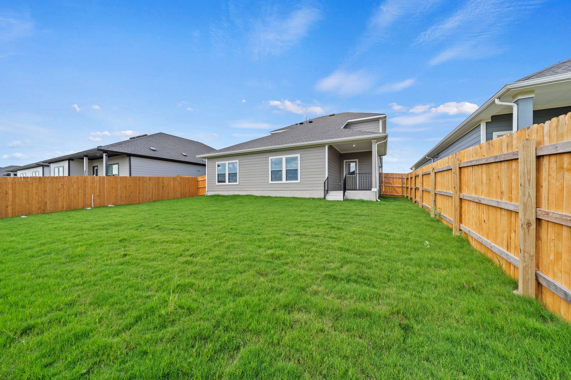 172 Wind Hill Jarrell, TX 76537 - Photo 29 of 30 Rear of Home and Private Backyard
