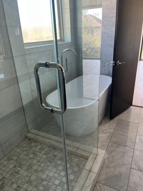 1255 Utah Street Houston, TX 77007 - Photo 11 of 17 a bath tub sitting in a bathroom next to a window