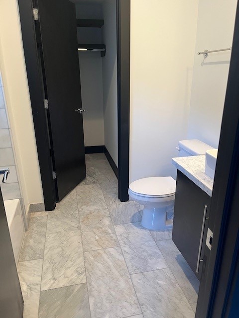 1255 Utah Street Houston, TX 77007 - Photo 14 of 17 a bathroom with a sink and a toilet
