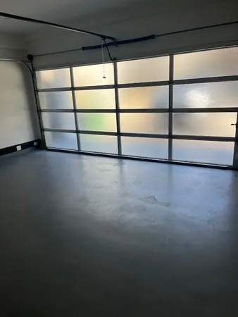 a view of a room with rack on the wall and a window