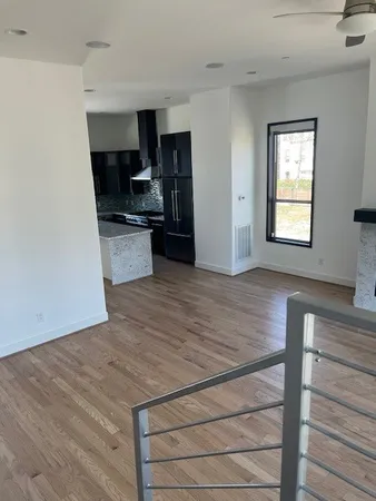 a kitchen with stainless steel appliances a refrigerator and a stove top oven