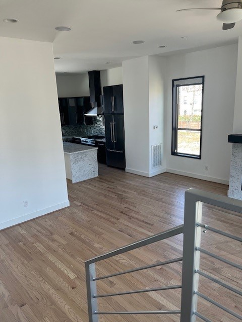 1255 Utah Street Houston, TX 77007 - Photo 10 of 17 a kitchen with stainless steel appliances a refrigerator and a stove top oven