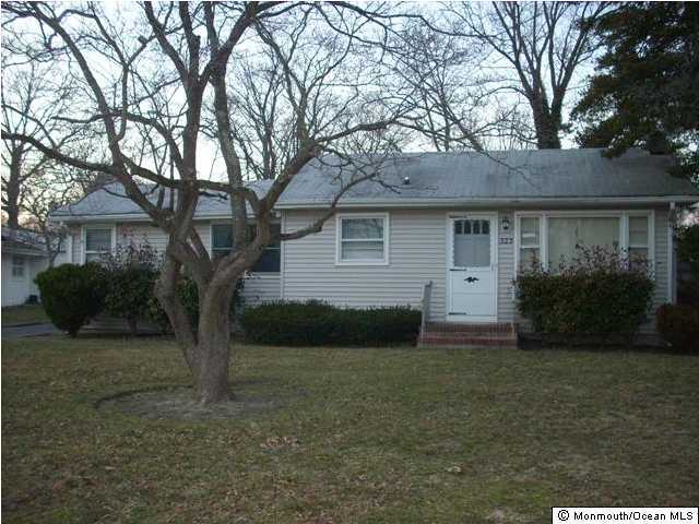 323 Sudbury Road Point Pleasant, NJ 08742 - Photo 1 of 3 a view of a house with a yard