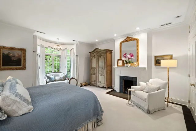 a bed room with furniture and a fireplace