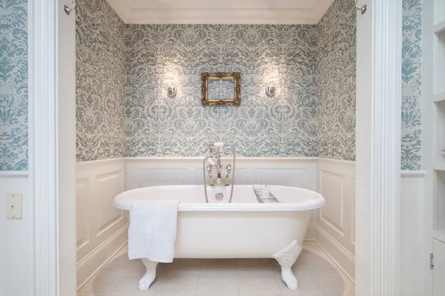 a white bath tub sitting in a bathroom