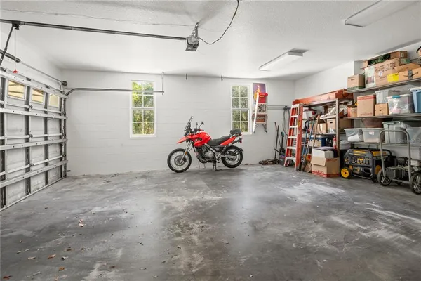 a view of a house with a yard and tree s