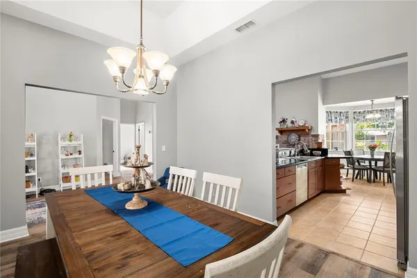 a living room with furniture a fireplace and a window