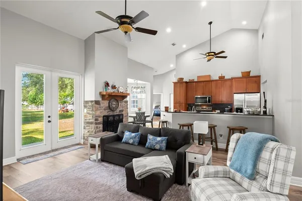 a living room with furniture and kitchen view