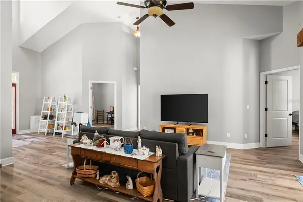 a kitchen with stainless steel appliances a stove a sink a microwave and refrigerator