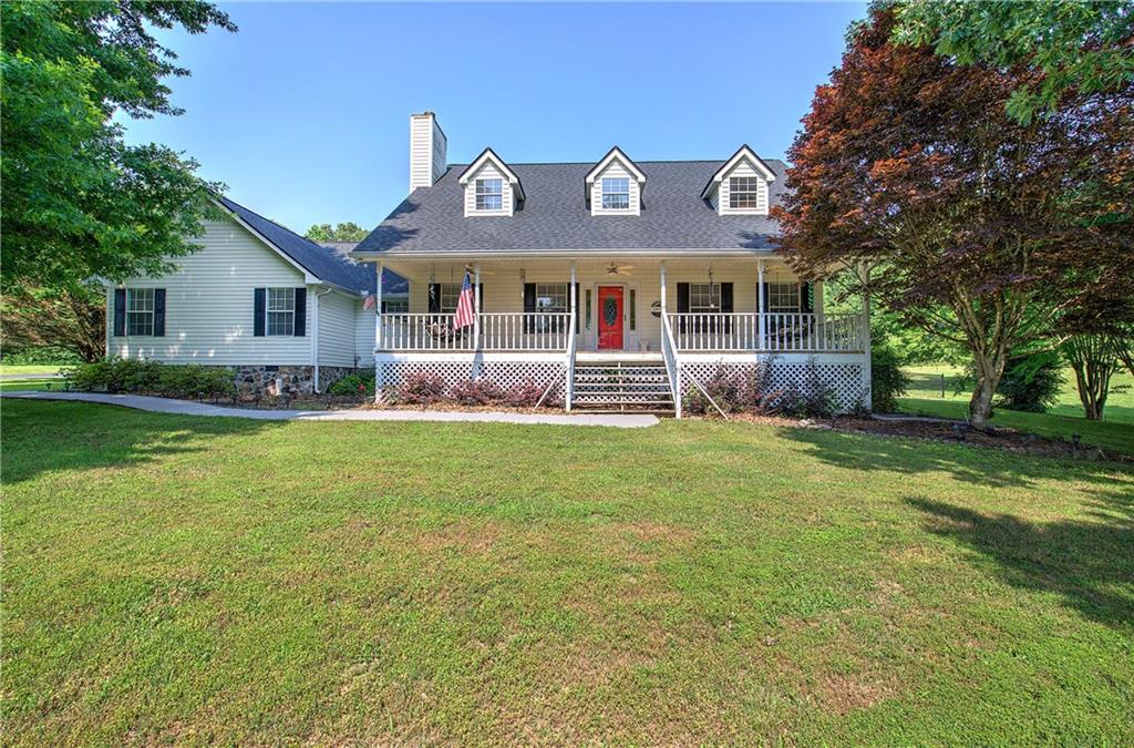 2909 Roland Hayes Parkway Southwest Calhoun, GA 30701 - Photo 1 of 1 a front view of a house with garden