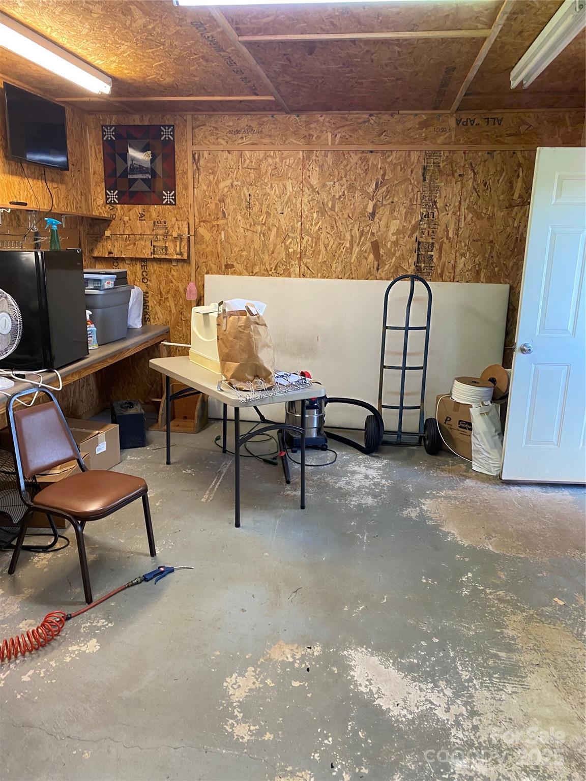 9525 Mull Road Vale, NC 28168 - Photo 28 of 36 a living room with furniture and a flat screen tv