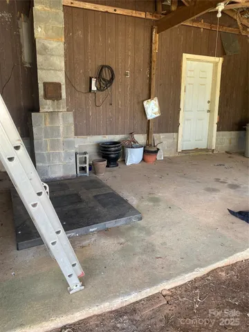 a view of living room with furniture and a fireplace